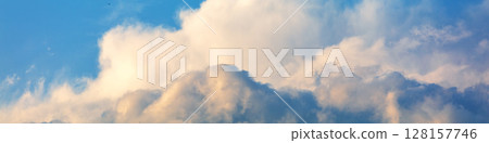 Blue cloudy sky on a sunny day. Sky texture. Abstract nature background. Horizontal banner Blue cloudy sky on a sunny day. Sky texture. Abstract nature background. Horizontal banner 128157746
