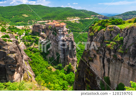 Ancient Greek monastery dramatically perched on cliffs in Meteora Greece Ancient Greek monastery dramatically perched on cliffs in Meteora Greece 128159701