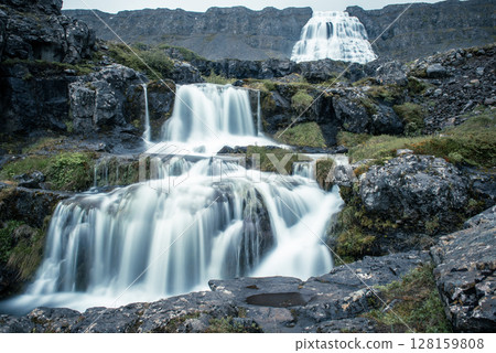 Dynjandi is one the most famous waterfall of the West Fjords of Iceland at summer Dynjandi is one the most famous waterfall of the West Fjords of Iceland at summer 128159808