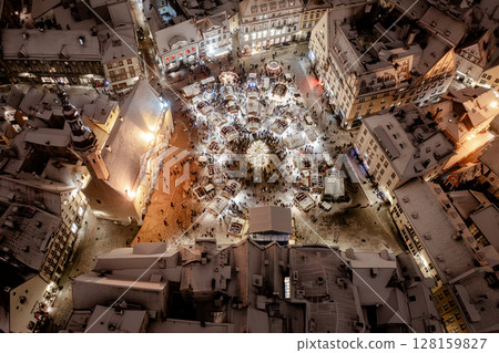 Aerial night View of Tallinn with the Town Hall Square in winter, roofs with snow, Christmas mood 128159827