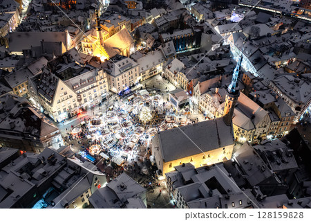 Aerial night View of Tallinn with the Town Hall Square in winter, roofs with snow, Christmas mood Aerial night View of Tallinn with the Town Hall Square in winter, roofs with snow, Christmas mood 128159828