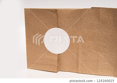 Cardboard box with circular cutout on white background Cardboard box with circular cutout on white background 128160025