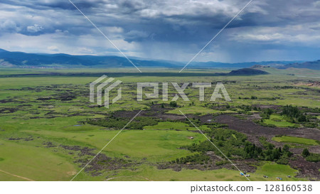 Steppe and mountains with rain landscape Steppe and mountains with rain landscape 128160538