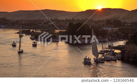 felucca boats on Nile river in Aswan at sunset felucca boats on Nile river in Aswan at sunset 128160548