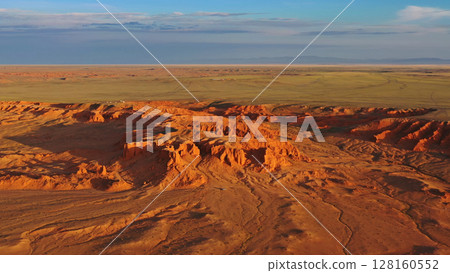 Bayanzag flaming cliffs at sunset in Mongolia Bayanzag flaming cliffs at sunset in Mongolia 128160552