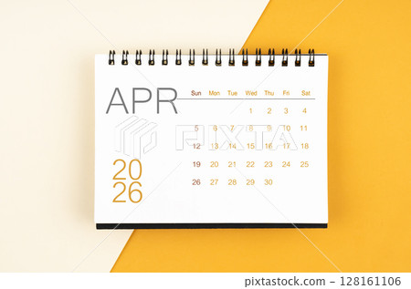 Desk calendar for April 2026 year on yellow color background, Flat lay. Desk calendar for April 2026 year on yellow color background, Flat lay. 128161106