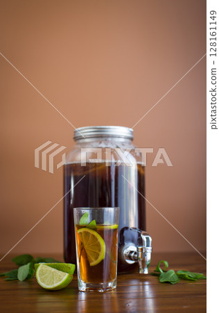Natural fermented drink with mint and citrus on wood background 128161149