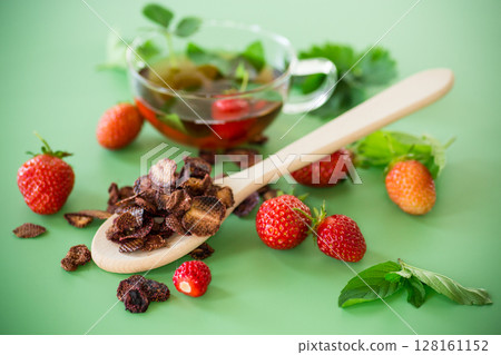 Strawberry fruit tea in a glass teapot from above Strawberry fruit tea in a glass teapot from above 128161152