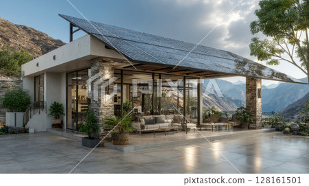 Modern eco-friendly house with large solar panels on the roof, surrounded by mountains and lush greenery 128161501