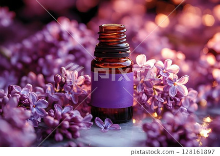 Amber Bottle of Lilac Essential Oil Amidst Blossoms 128161897