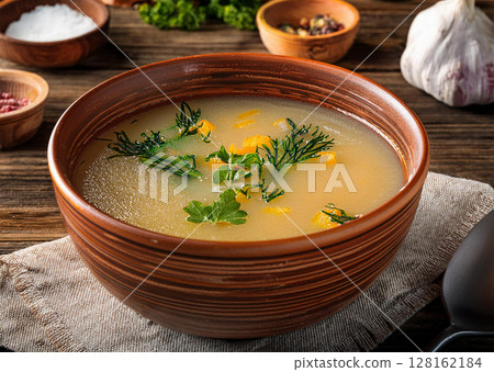 Delicious Clear Soup with Fresh Herbs 128162184