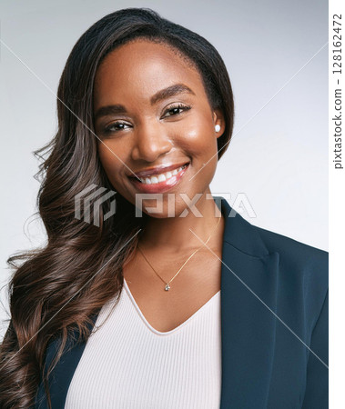 Elegant Young Woman with Warm Expression 128162472