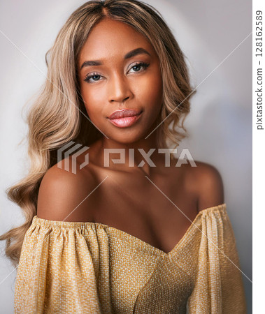 Graceful Young Woman in Floral Sundress 128162589