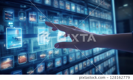 hand interacting with digital interface showing various images a 128162779