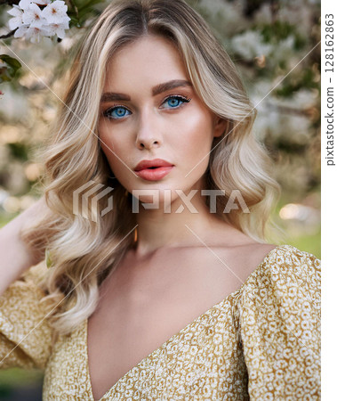 Graceful Young Woman in Floral Sundress Graceful Young Woman in Floral Sundress 128162863