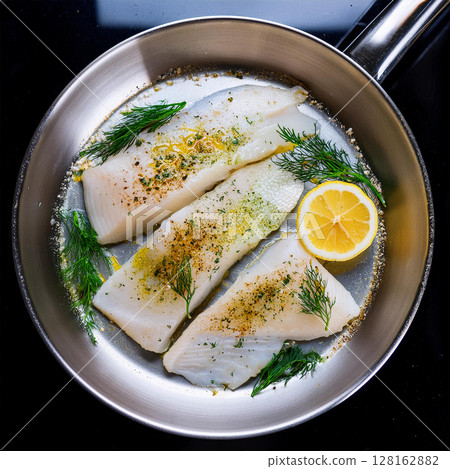 Delicate White Fish Fillets in Pan 128162882