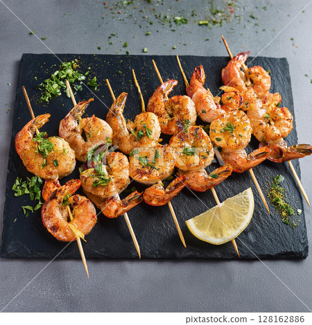 Vibrant Grilled Shrimp Skewers on Gray 128162886
