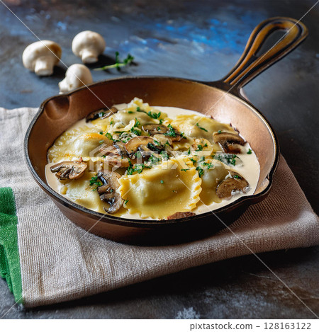 Creamy Ravioli Dish in Rustic Skillet 128163122