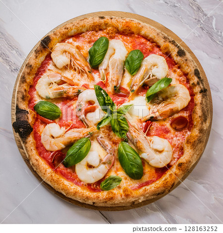 Vibrant Seafood Pizza with Fresh Ingredients 128163252