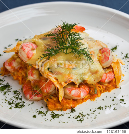 Seafood Lasagna Beautifully Garnished on Plate 128163466