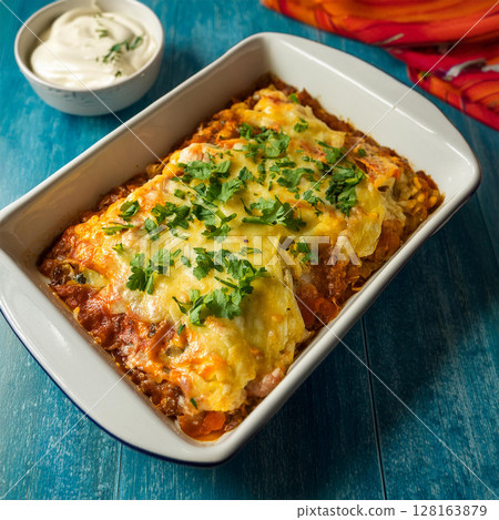 Hearty Baked Dish with Golden Cheese Hearty Baked Dish with Golden Cheese 128163879