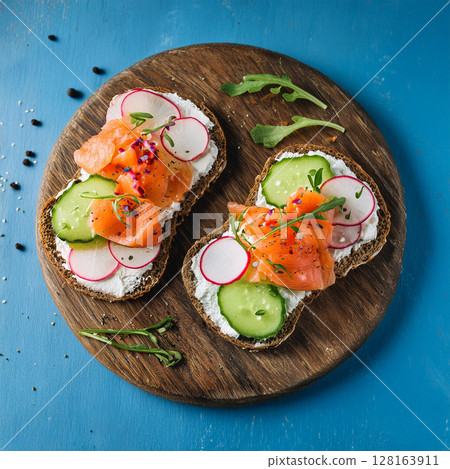 Fresh Open Faced Sandwiches on Rustic Board 128163911