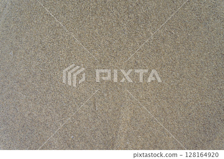 Sand under water, beige textured surface. Top down view 128164920
