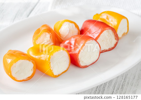 Colorful Baby Bell Peppers Stuffed With Cream Cheese on White Plate Colorful Baby Bell Peppers Stuffed With Cream Cheese on White Plate 128165177