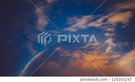 Amazing Sunrise and Night Starry Sky In Different Colors. Misty Night Natural Background. Colorful flare flash haze on starry Sky Background Backdrop. Colorful flare flash haze on starry sky. 128165297