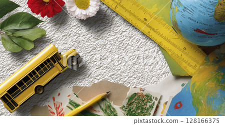 Colorful school supplies and globe arranged on textured background for back to school theme 128166375
