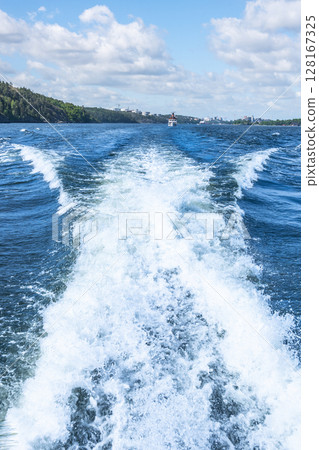Rough water behind the boat. Seacruise in Sweden on a sunny and clear day Rough water behind the boat. Seacruise in Sweden on a sunny and clear day 128167325