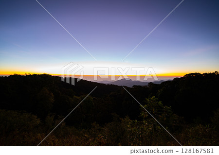 The beautiful sunrise at Doi intanon national park, Chiang Mai in the morning.Sun is rising from the hill to shy with beautiful yellow orange light. 128167581