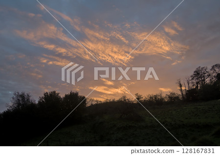 sunset on a winter day in the mountains with a beautiful sky sunset on a winter day in the mountains with a beautiful sky 128167831