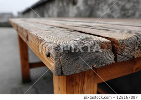 Rustic wooden table close-up on rooftop terrace with urban backdrop during overcast sky Rustic wooden table close-up on rooftop terrace with urban backdrop during overcast sky 128167897