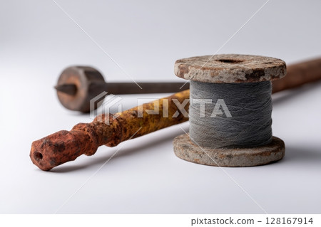 Vintage sewing tools and materials on a clean surface showcasing craftsmanship and history 128167914