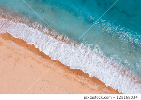 beautiful waves on sand. 128169034