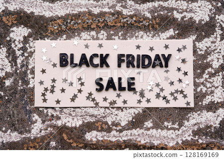 Abstract background of silver sequins with the inscription BLACK FRIDAY SALE. 128169169