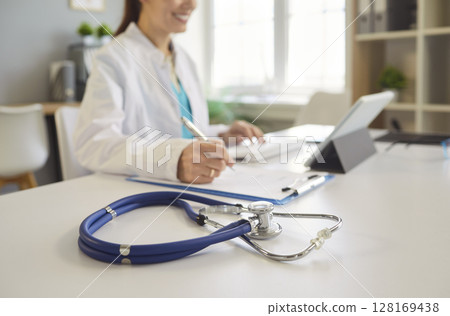 Stethoscope With Doctor Working In Hospital Stethoscope With Doctor Working In Hospital 128169438