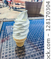 Ice cream cone on the table at summer time. 128170304
