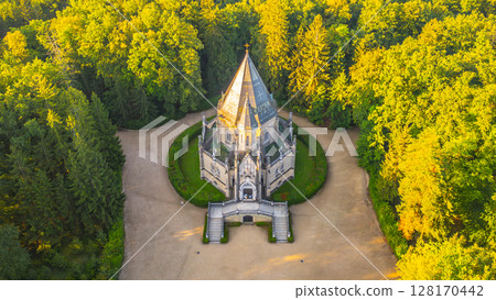 The Schwarzenberg Tomb stands majestically in Domanin, nestled among lush greenery. This historical monument features intricate architecture, inviting visitors to explore its serene beauty and rich 128170442