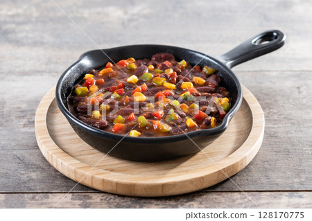 Mexican chilli beans with vegetables in iron pan 128170775