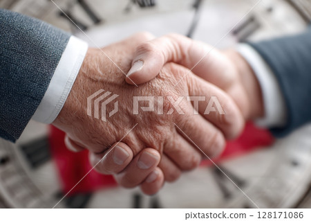 A handshake symbolizes teamwork and commitment, highlighting collaboration for shared success 128171086