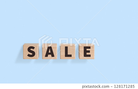 Wooden Blocks with SALE Text on blue Background for Promotional Designs 128171285
