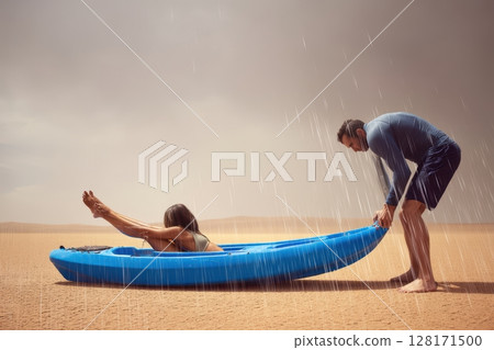 Experience an unforgettable desert adventure kayaking beneath a dramatic, stormy sky 128171500