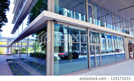Downtown corporate business district architecture. Glass reflective office buildings against blue sky and sun light. Economy, finances, business activity concept. Abstract modern architecture fragment 128171631