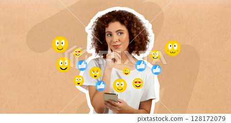 In a cozy indoor setting, a woman with curly hair smiles thoughtfully at her smartphone. Social media reaction emojis surround her, reflecting her engaging chat. It's a vibrant moment of connectivity. 128172079
