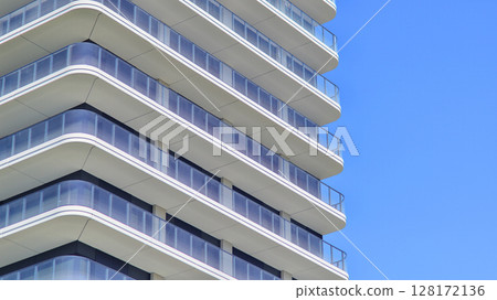 Downtown modern residential architecture. Architectural details of modern apartment building. Modern european residential apartment building complex. 128172136