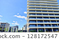 Exterior of a high modern multi-story apartment building - facade, windows and balconies. 128172547