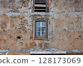 Damaged wall bullet hole after war 128173069