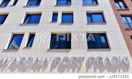 Warsaw, Poland. 22 June 2025. Urban landscape. Neon sign with the inscription: Warsaw Port Praski. Warsaw, Poland. 22 June 2025. Urban landscape. Neon sign with the inscription: Warsaw Port Praski. 128173250